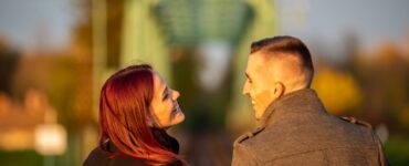 man and woman standing side by side during daytime